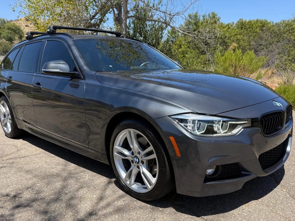 BMW 330i xDrive Sports Wagon — illustrative model photo